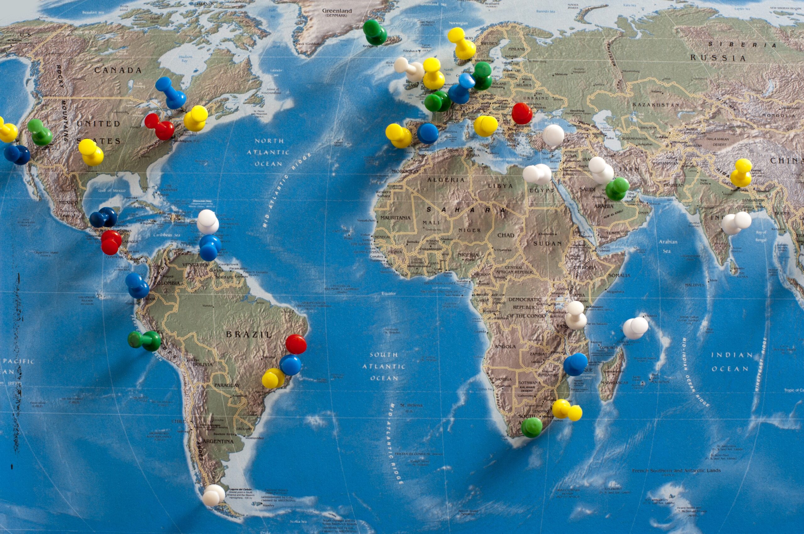 Free Stock Photo 10699 Multi Colored Thumb Tacks Inserted In World Map Freeimageslive